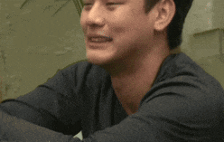 a close up of a man 's face with a blurred background .
