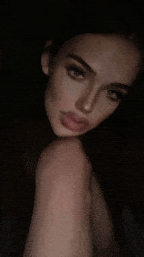 a woman taking a selfie with her tongue out