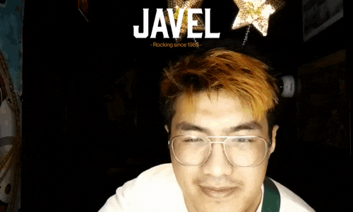a man wearing glasses and a star headband with the name javel on it