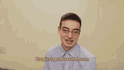 a man with glasses is pointing at the camera and says `` you just got roasted , son . ''