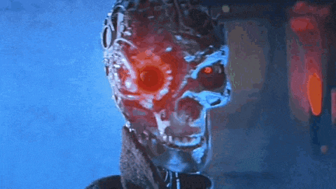 a close up of a robot 's face with red eyes and a blue background .