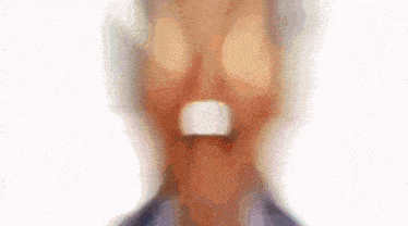 a blurry image of a man in a suit and tie