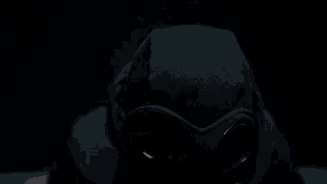 a black background with a reflection of a person in the water