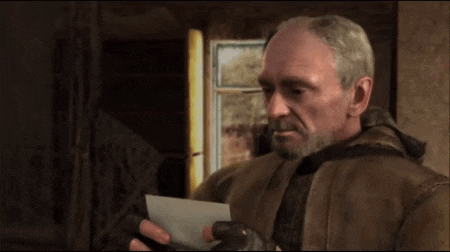 a man with a beard is holding an envelope in his hand