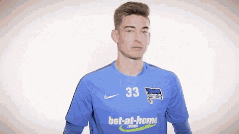 a soccer player wearing a blue jersey with the number 33 on it