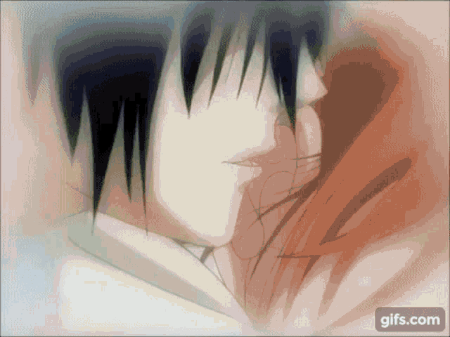 a man and a woman are kissing each other in a close up of their faces .