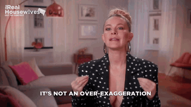 a woman says it 's not an over exaggeration in front of a couch