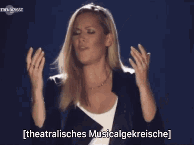 a woman with her hands in the air and the words theatraliches musicalgekreische on the bottom