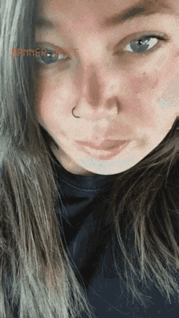 a close up of a woman 's face with banner jones written on the bottom right