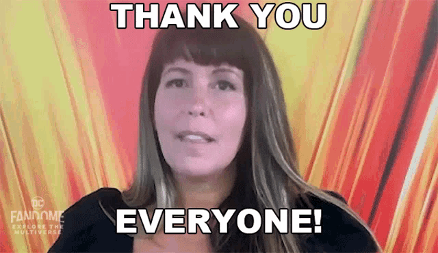 a woman is saying " thank you everyone " in front of a colorful background