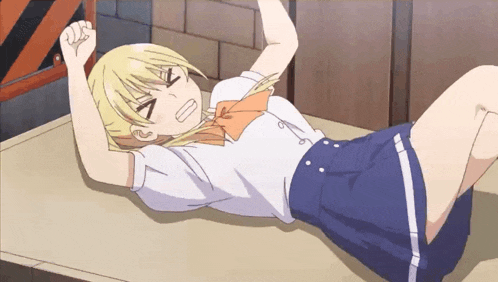 a blonde anime girl laying on a table with her arms up