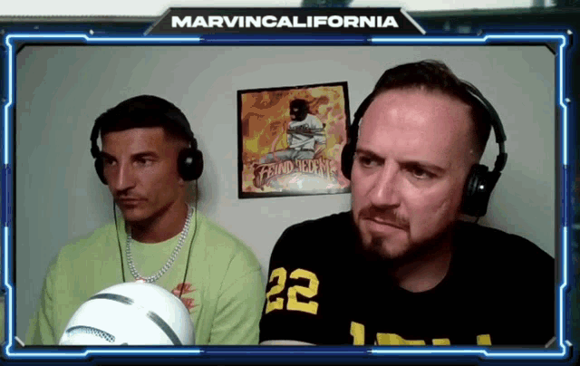 two men wearing headphones in front of a poster that says marvincalifornia