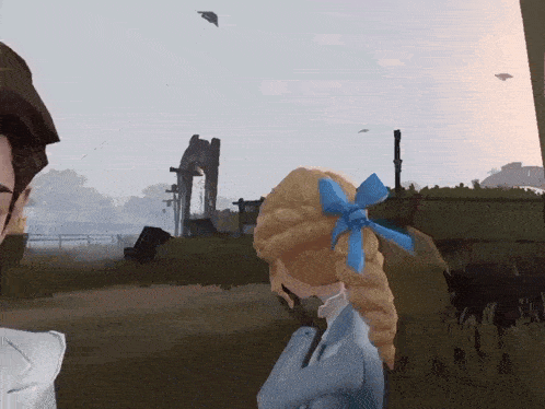 a girl with a blue bow in her hair is standing next to a man in a field .