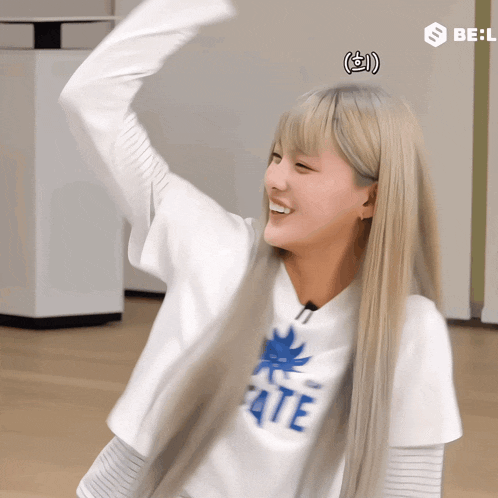 a blonde girl wearing a white shirt that says fate