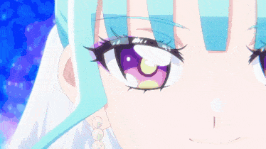 a close up of a girl 's face with a blue hair