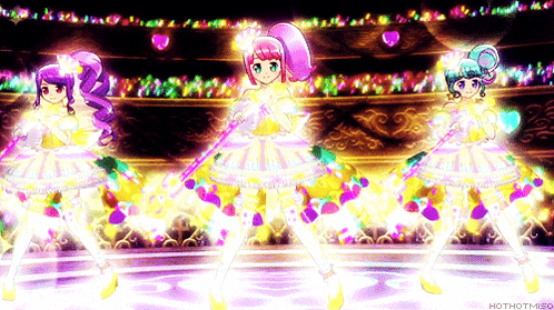 three anime girls are dancing on a stage with the words hothotmiso on the bottom right
