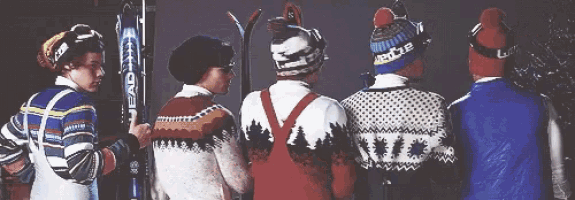 a group of people standing next to each other with one wearing a hat that says eddie