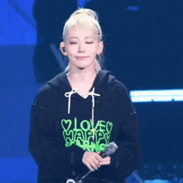 a woman wearing a black hoodie that says " i love war fearn " on it