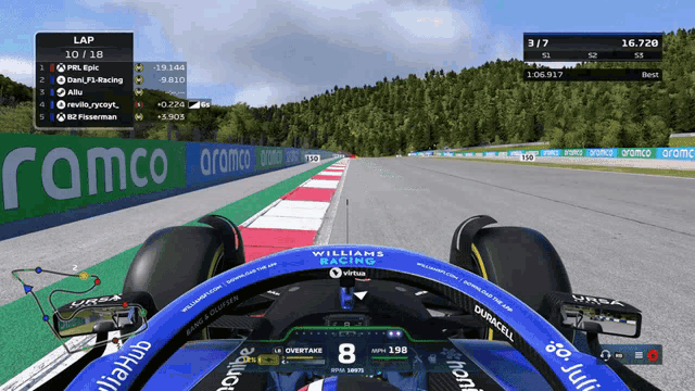 a williams racing race car is driving down a track