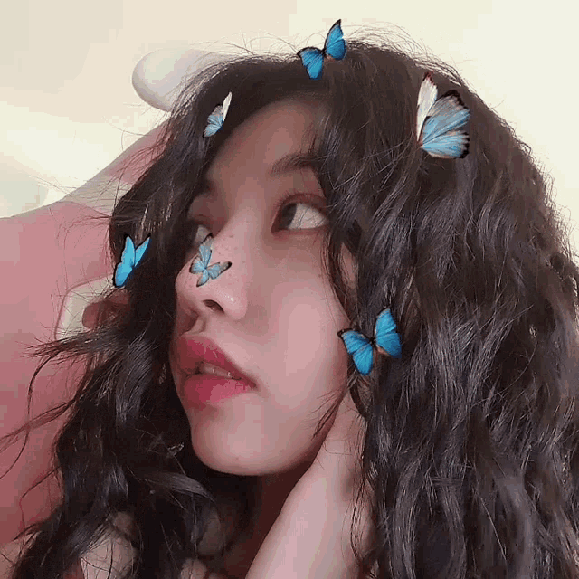 a girl with blue butterflies on her hair
