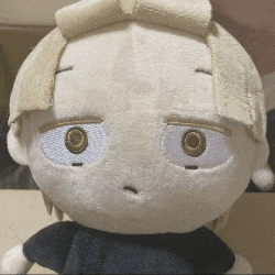 a close up of a stuffed toy with a sad look on his face