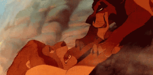 a lion and a tiger from the lion king are laying on the ground .