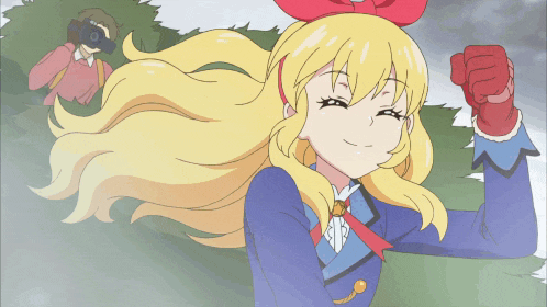 a cartoon of a girl with long blonde hair and a red bow on her head