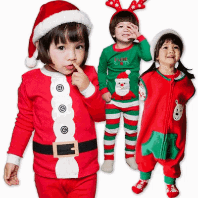a little girl wearing a santa costume and a little boy wearing a reindeer headband are standing next to each other