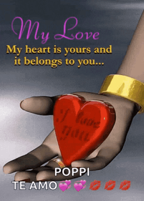 a hand holding a red heart that says i love you on it