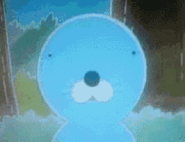a close up of a blue cartoon seal with a black nose standing in front of a window .