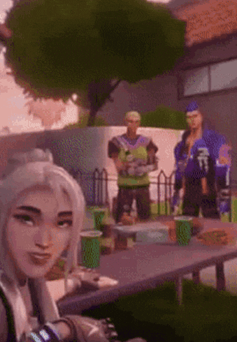 a woman is sitting at a table with a man standing behind her in a video game .