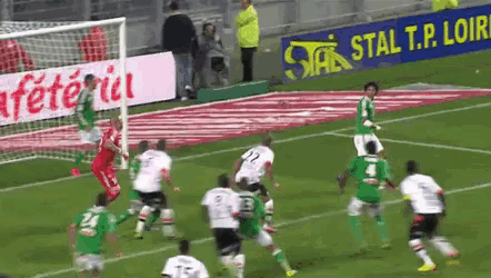 a soccer game is being played on a field with a sign that says stal t.p. loire