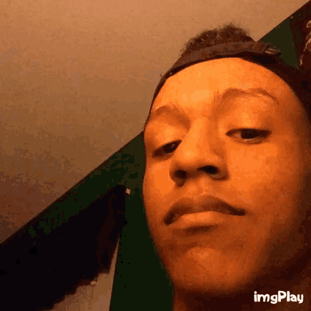 a close up of a person 's face with imgplay at the bottom right