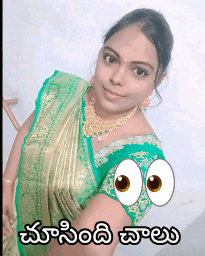 a woman in a green and gold saree has a cartoon eye on her shoulder and a caption in another language