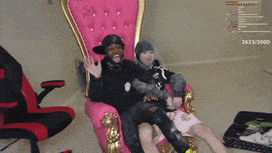 two people are sitting in a chair with the number 263/3000 on the bottom
