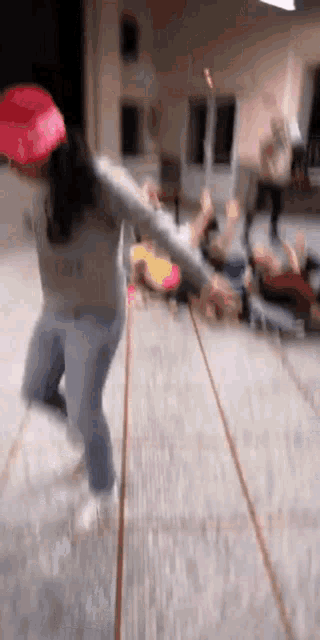 a girl wearing a red hat and a sweater that says taylor on it