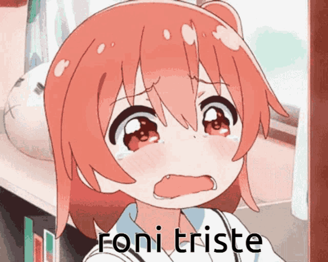 a girl with red hair is crying with the words foni triste written below her