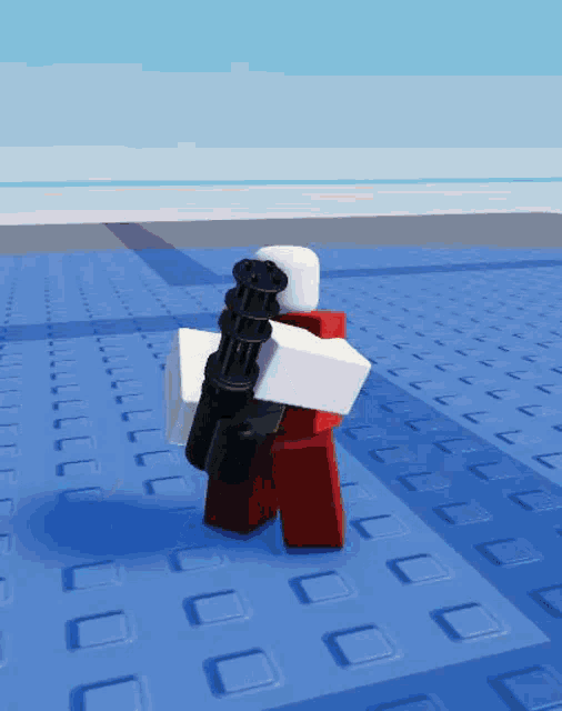 a roblox character is holding a machine gun on a blue floor .