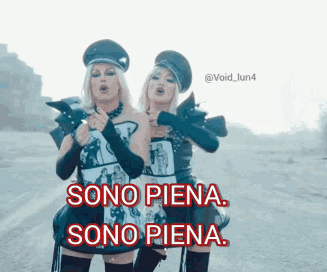 two women standing next to each other with sono piena sono piena written in red