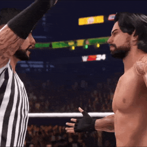 a referee and a wrestler are facing each other in a wrestling match