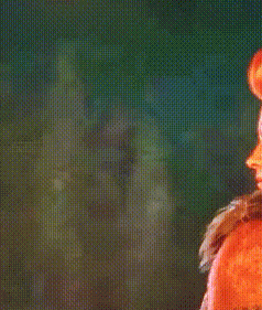 a close up of a person 's face with a blurred background .