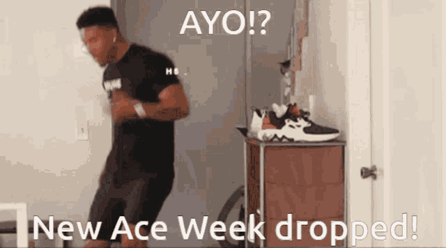 a man in a black shirt is dancing in front of a dresser with the words " new ace week dropped " written on it