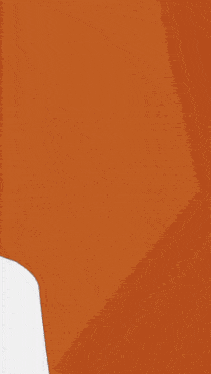 a girl with red hair is peeking out of behind a wall