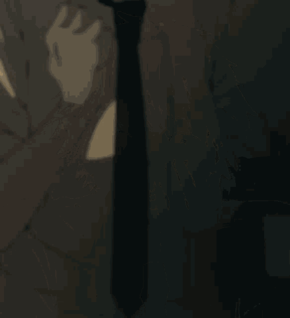 a close up of a man with his mouth open in a dark room