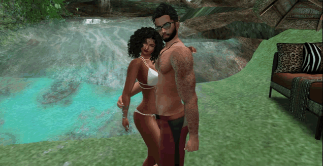 a man and a woman are posing in front of a waterfall in a video game