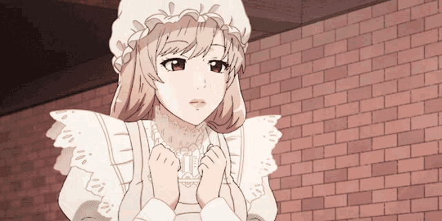a girl in a white dress and hat is standing in front of a brick wall