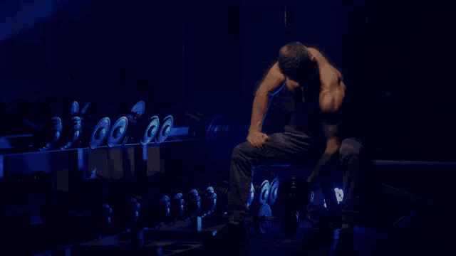 an advertisement for find your gym in dubai shows a man lifting weights