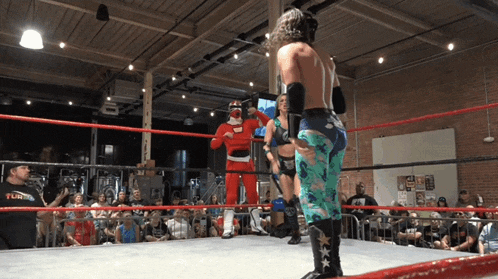 a wrestling ring with a man wearing a shirt that says fury