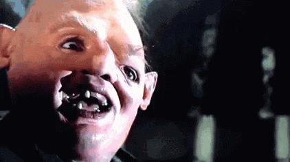 a close up of a person 's face with a very ugly face .