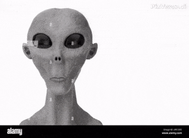 a black and white photo of an alien with horns on his head ..